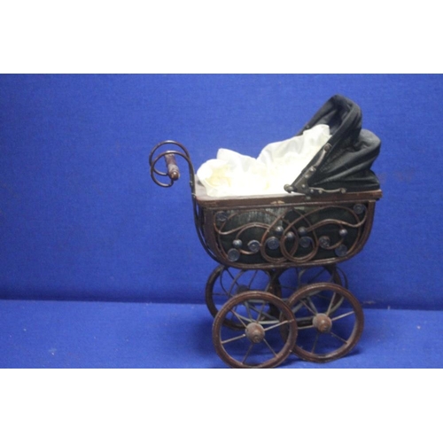 176 - A VINTAGE DOLLS PRAM