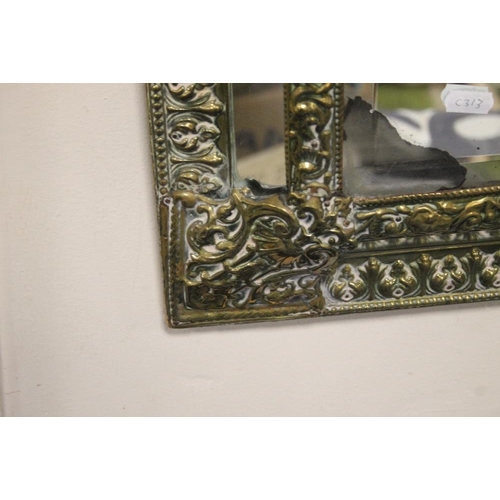 19 - A DECORATIVE GILT MIRROR