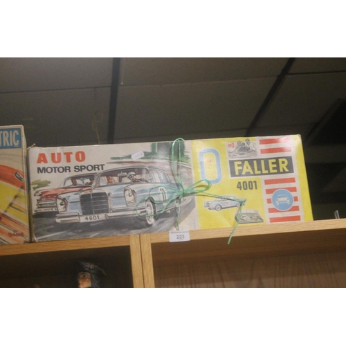 223 - A BOXED AUTO MOTOR SPORT FALLER CAR SET TOGETHER WITH A SCALEXTRIC YS100 CONVERSION SET