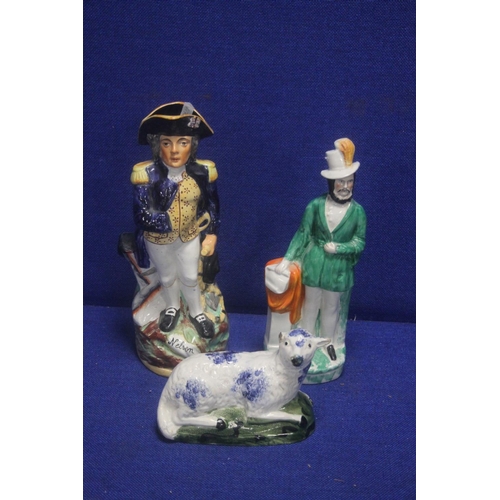 224 - TWO CONTINENTAL STYLE FIGURES TOGETHER WITH A STAFFORSHIRE STYLE FIGURE OF A SHEEP