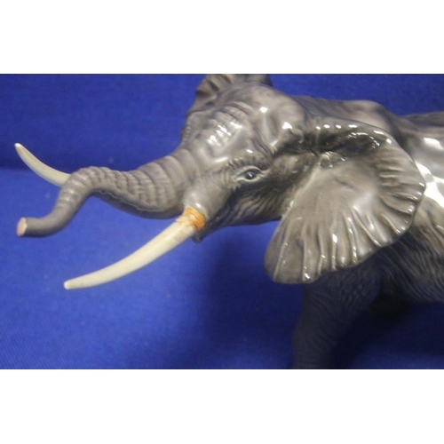 226 - A BESWICK ELEPHANT A/F TOGETHER WITH A BESWICK TROUT A/F