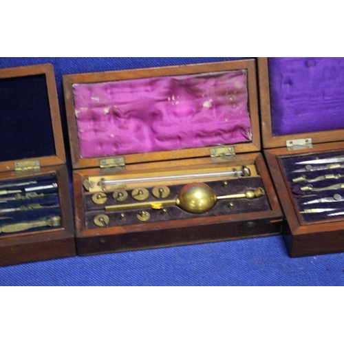 237 - TWO CASED COMPASS SETS TOGETHER WITH A CASED HYDROMETER AND A PART CASED STAMP SET