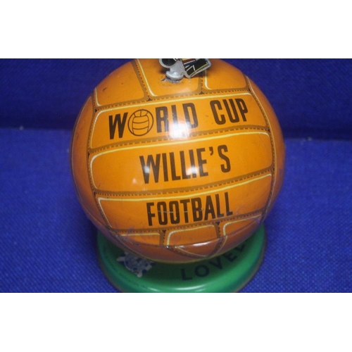 296 - A 1966 WORLD CUP WILLIE LOVELLS TOFFEE TIN IN THE FORM OF A FOOTBALL, TOPPED BY A WORLD CUP WILLIE F... 