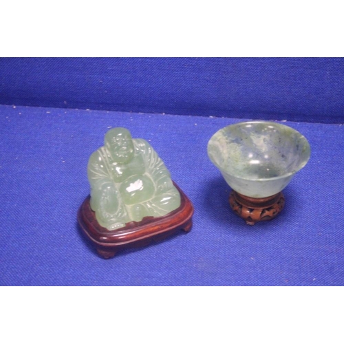 297 - A CARVED SOAP STONE FIGURE OF A BUDDAH TOGETHER WITH AN ORIENTAL TYPE DISH