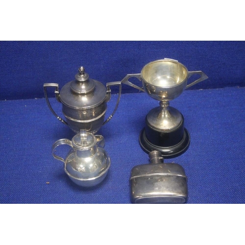 307 - TWO HALLMARKED SILVER TROPHY'S TOGETHER WITH A HALLMARKED SILVER HIP FLASK AND JUG