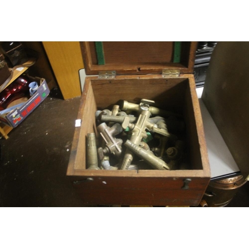 321 - A BOX OF BRASS TAPS