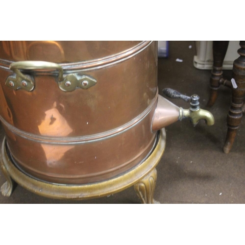 337 - A LARGE COPPER TEA URN ON CAST IRON STAND