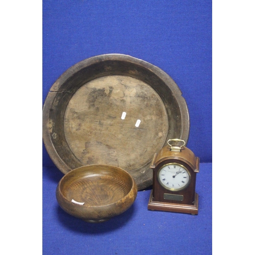 353 - A LARGE ANTIQUE WOODEN BOWL TOGETHER WITH A SMALLER WOODEN BOWL AND A CLOCK