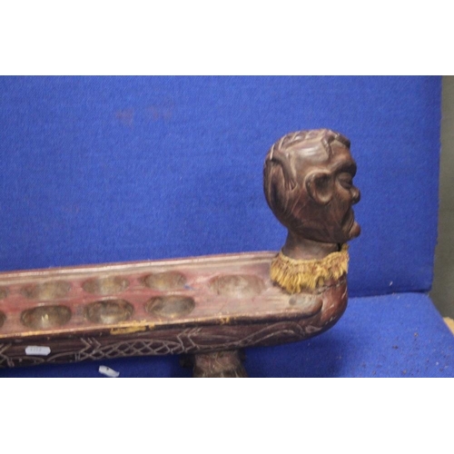 368 - AN UNUSUAL CARVED TRIBAL RACK WITH HEAD TO EACH END EACH WITH A LIZARD ON TOP