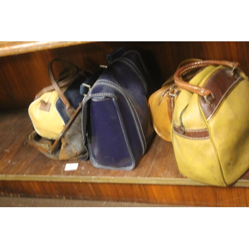 374 - A QUANTITY OF BOWLS IN LEATHER BAGS