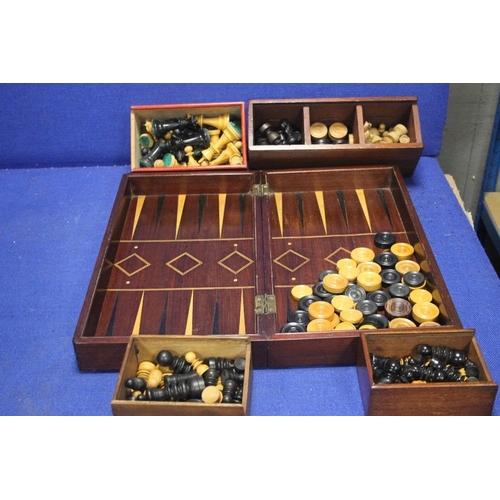 460 - A WOODEN GAMES BOX/ CHESS BOARD WITH DRAUGHTS SET AND 4 BOXED CHESS SETS