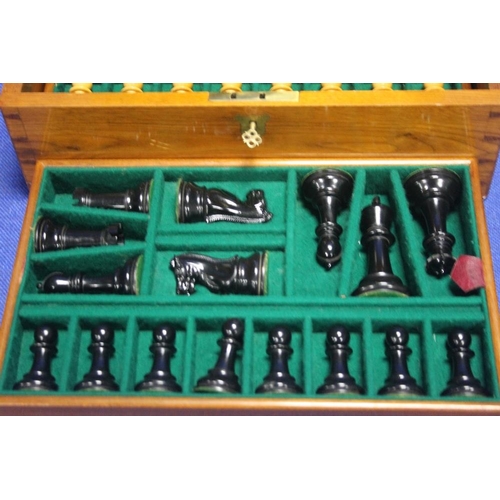 464 - A CASED STAUNTON CHESS SET AND BOARD WITH KEY