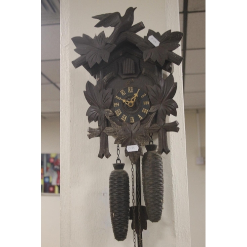 492 - A CARVED WOOD CUCKOO CLOCK A/F