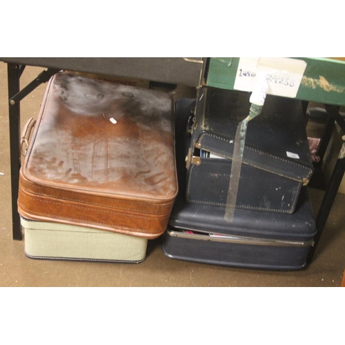 548 - FOUR VINTAGE SUITCASES