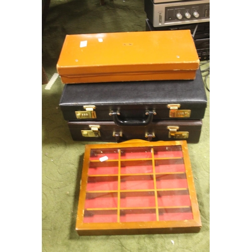 600 - A PAIR OF BRIEFCASES, A SMALL VINTAGE LEATHER CASE A WALL MOUNTED DISPLAY CABINET ETC