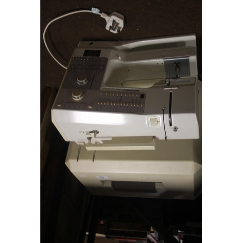 602 - A CASED BERNINA ELECTRIC SEWING MACHINE WITH LEAD