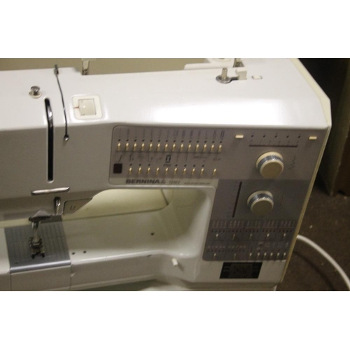 602 - A CASED BERNINA ELECTRIC SEWING MACHINE WITH LEAD