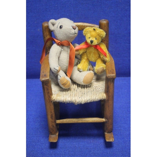 65 - TWO 'MERRYTHOUGHT' BEARS TOGETHER WITH A SMALL ROCKING CHAIR