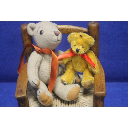 65 - TWO 'MERRYTHOUGHT' BEARS TOGETHER WITH A SMALL ROCKING CHAIR