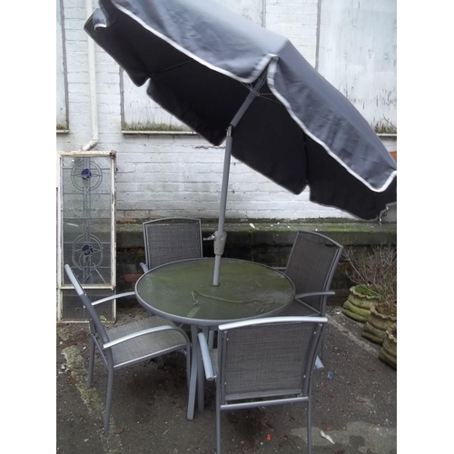 702 - A GARDEN SET GLASS TABLE AND 4 CHAIRS WITH PARASOL