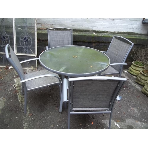 702 - A GARDEN SET GLASS TABLE AND 4 CHAIRS WITH PARASOL