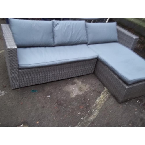 704 - A GARDEN FURNITURE RATTAN CORNER SOFA