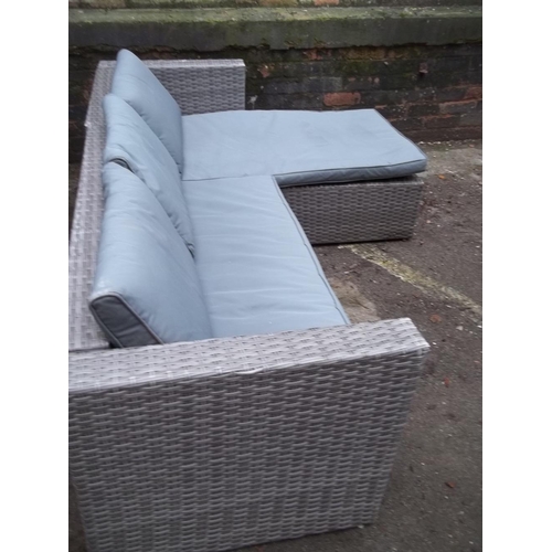 704 - A GARDEN FURNITURE RATTAN CORNER SOFA