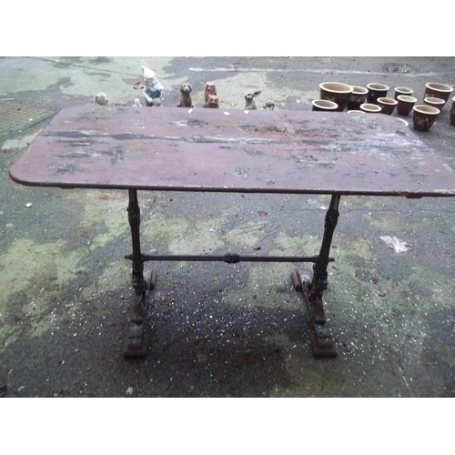 710 - AN ANTIQUE CAST IRON TABLE