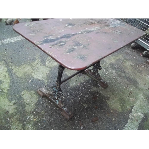 710 - AN ANTIQUE CAST IRON TABLE