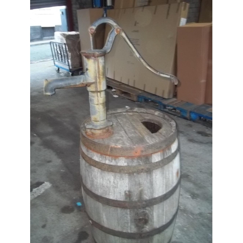 727 - AN OAK BEER BARREL WITH A CAST IRON SYPHON WATER TAP