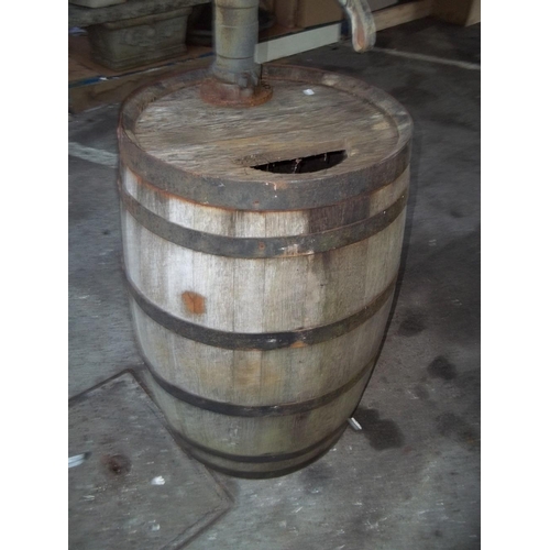 727 - AN OAK BEER BARREL WITH A CAST IRON SYPHON WATER TAP