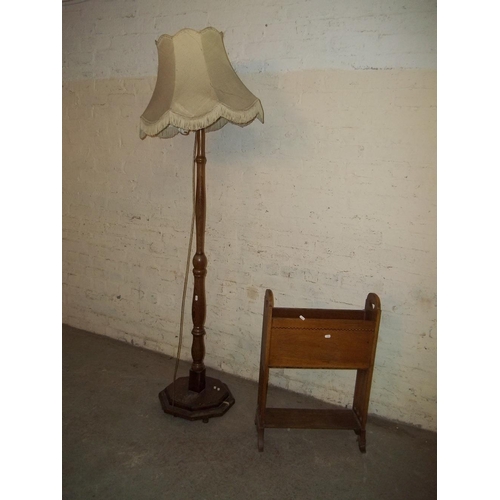 853 - A HEAVY OAK FLOOR STANDING STANDARD LAMP S/D AND A MAGAZINE RACK