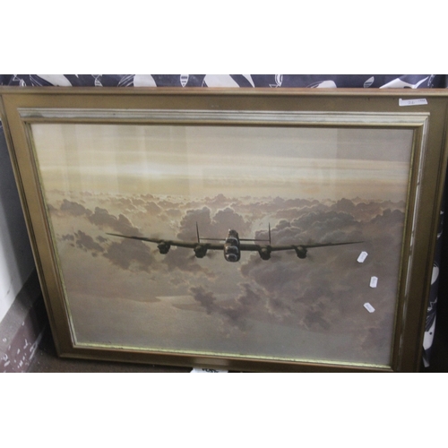 26 - A FRAMED AND GLAZED PRINT OF A LANCASTER BOMBER