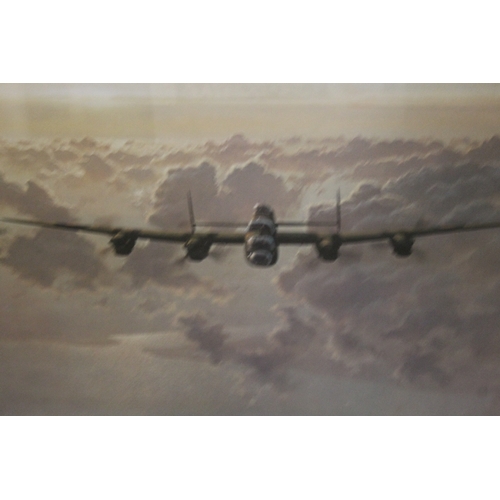 26 - A FRAMED AND GLAZED PRINT OF A LANCASTER BOMBER