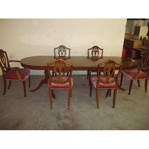 860 - AN EXTENDING DINING TABLE AND 6 CHAIRS