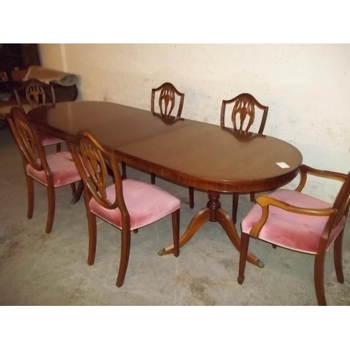 860 - AN EXTENDING DINING TABLE AND 6 CHAIRS