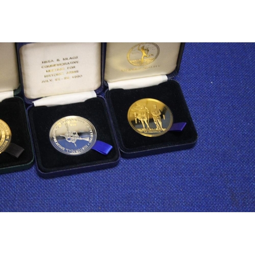 92 - FOUR CASED MEDALLIONS