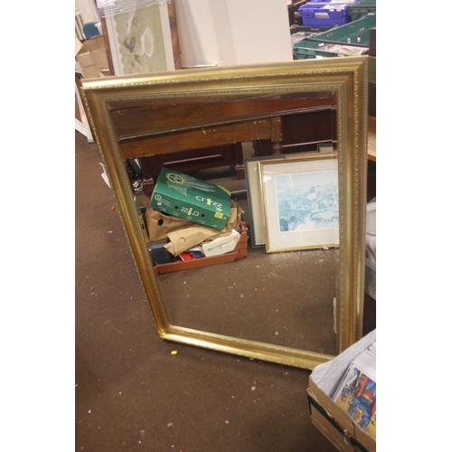 47 - A GILT FRAMED MIRROR 114 CM X 90 CM