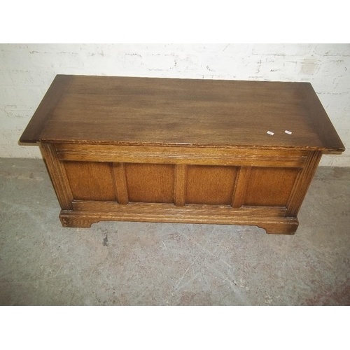 AN OAK OTTOMAN BLANKET BOX