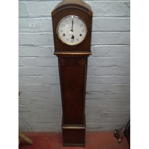 710 - AN OAK GRAND DAUGHTER CLOCK