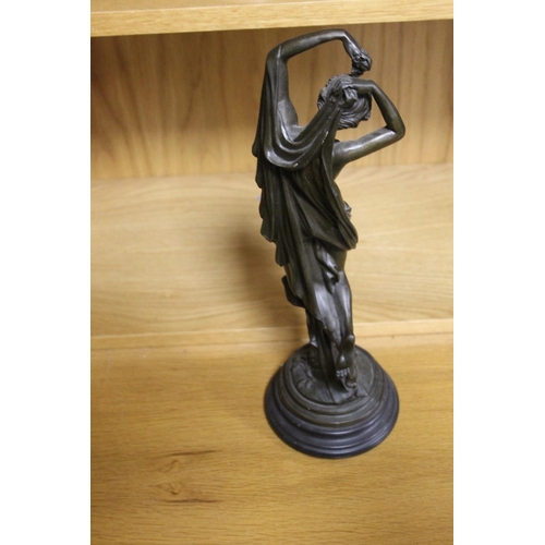 124 - A BRONZE TYPE FIGURE OF A LADY WITH A CHERUB