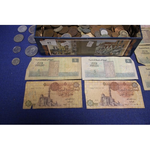 41 - A TIN OF COINS AND BANKNOTES