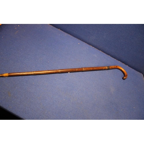 56 - AN EDWARDIAN WALKING STICK UMBERELLA