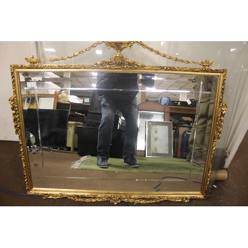 9 - A FRAMED DECORATIVE MIRROR