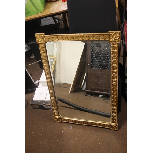 24 - A GILT DECORATIVE MIRROR 87 X 61 CM