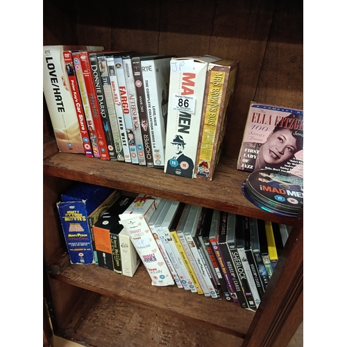 86 - DVD's & CD's in cabinet