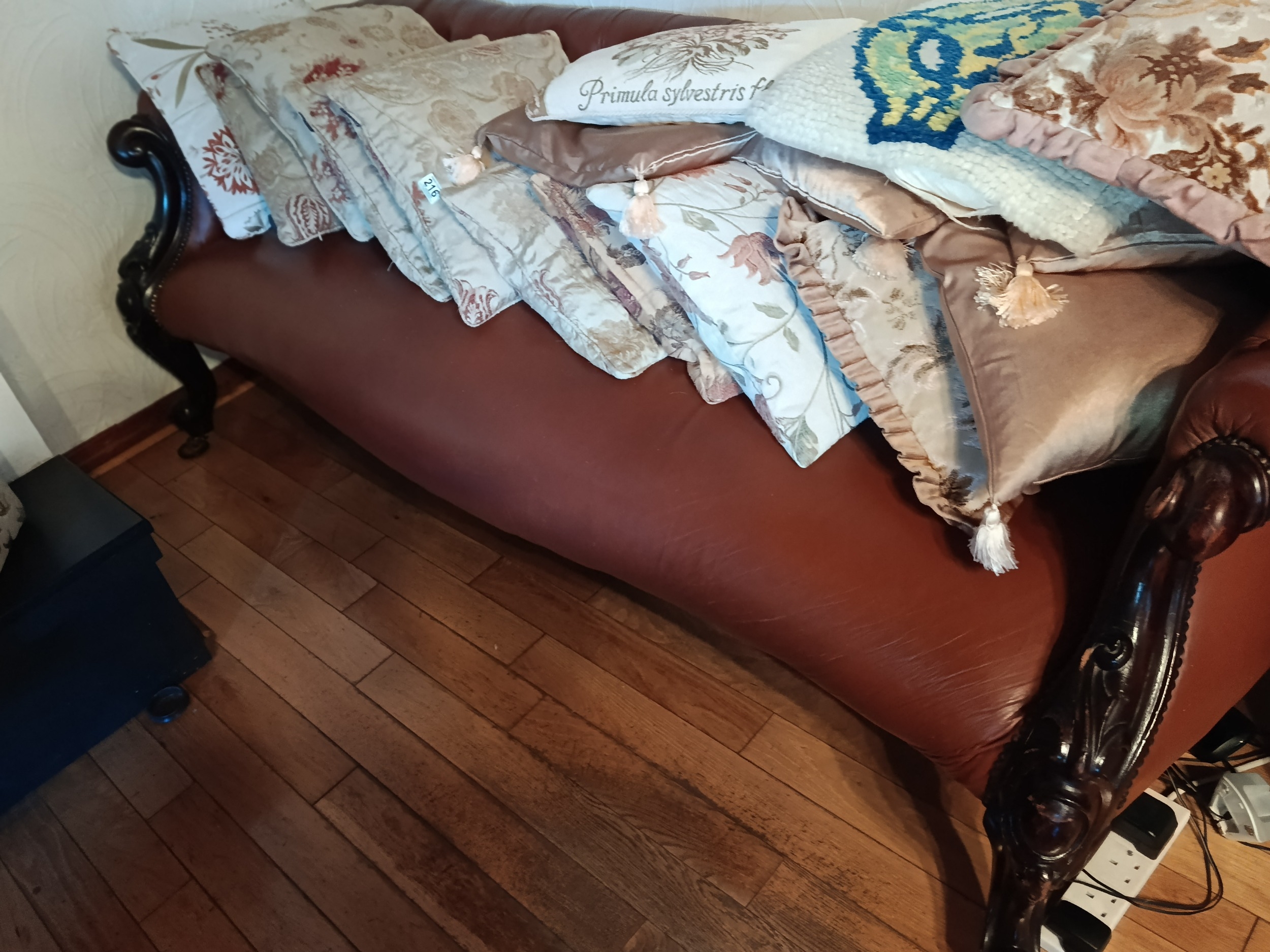 Button back Victorian scroll end leather double ended sofa