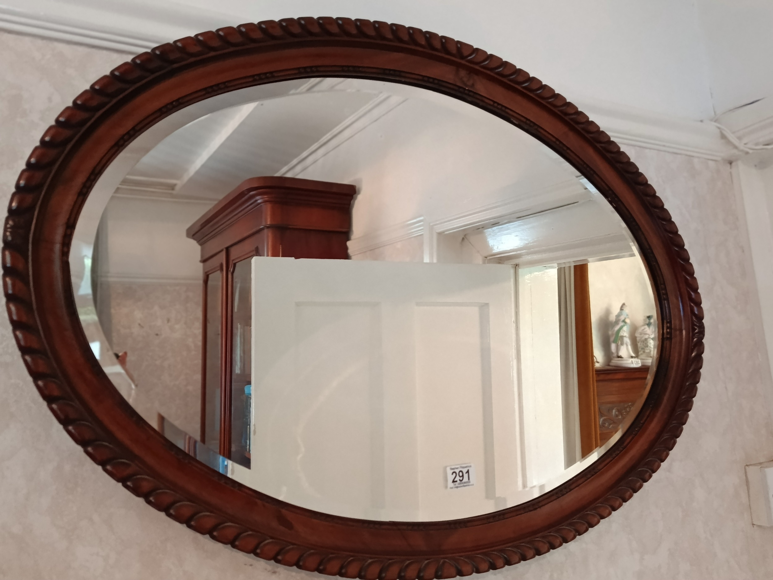 Mahogany oval mirror with pie crust edge