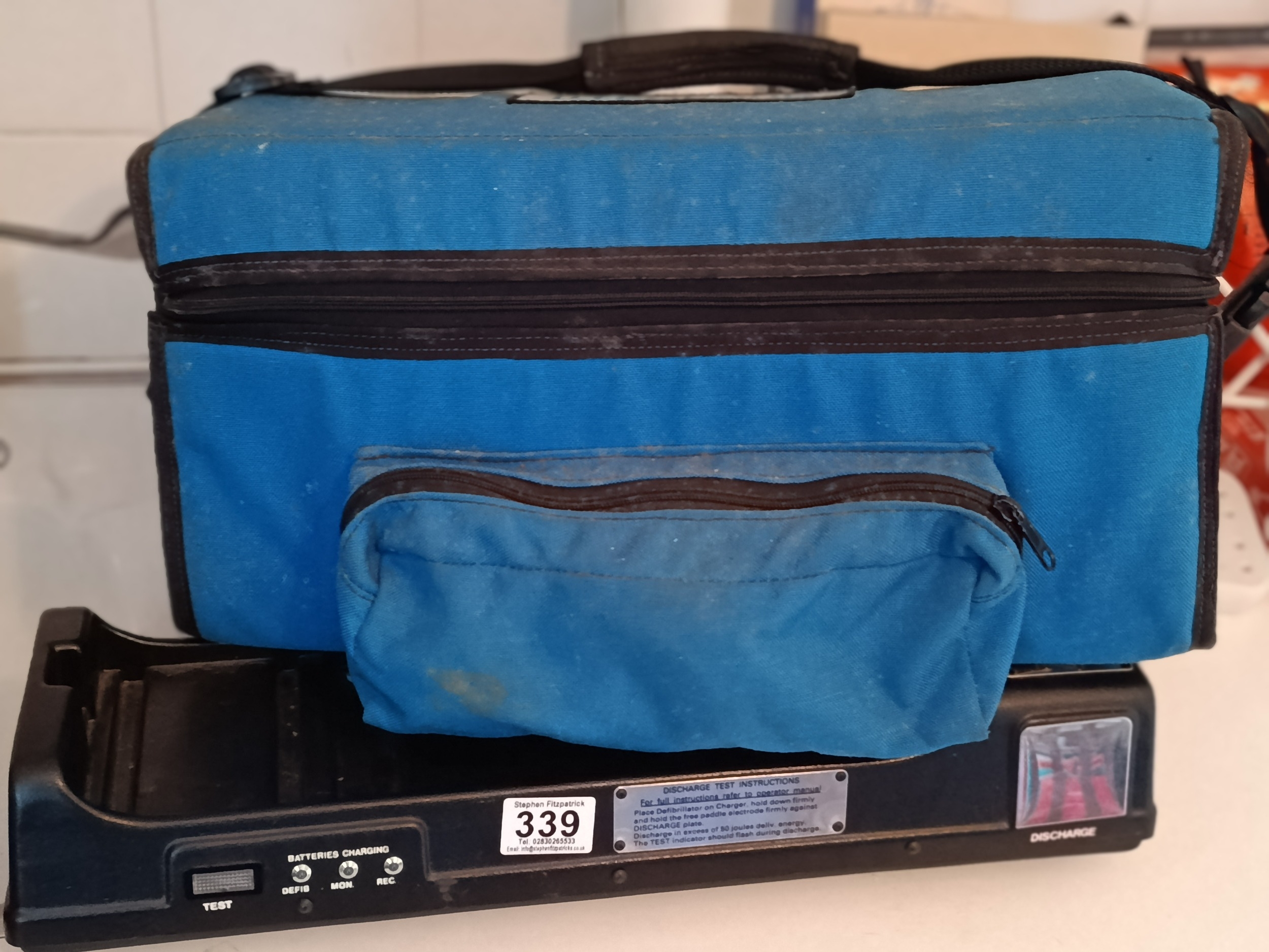 Defibrillator and charger