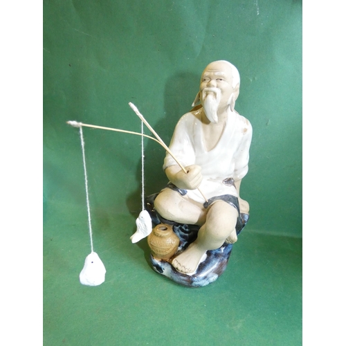 606 - JAPANESE CERAMIC FISHERMAN